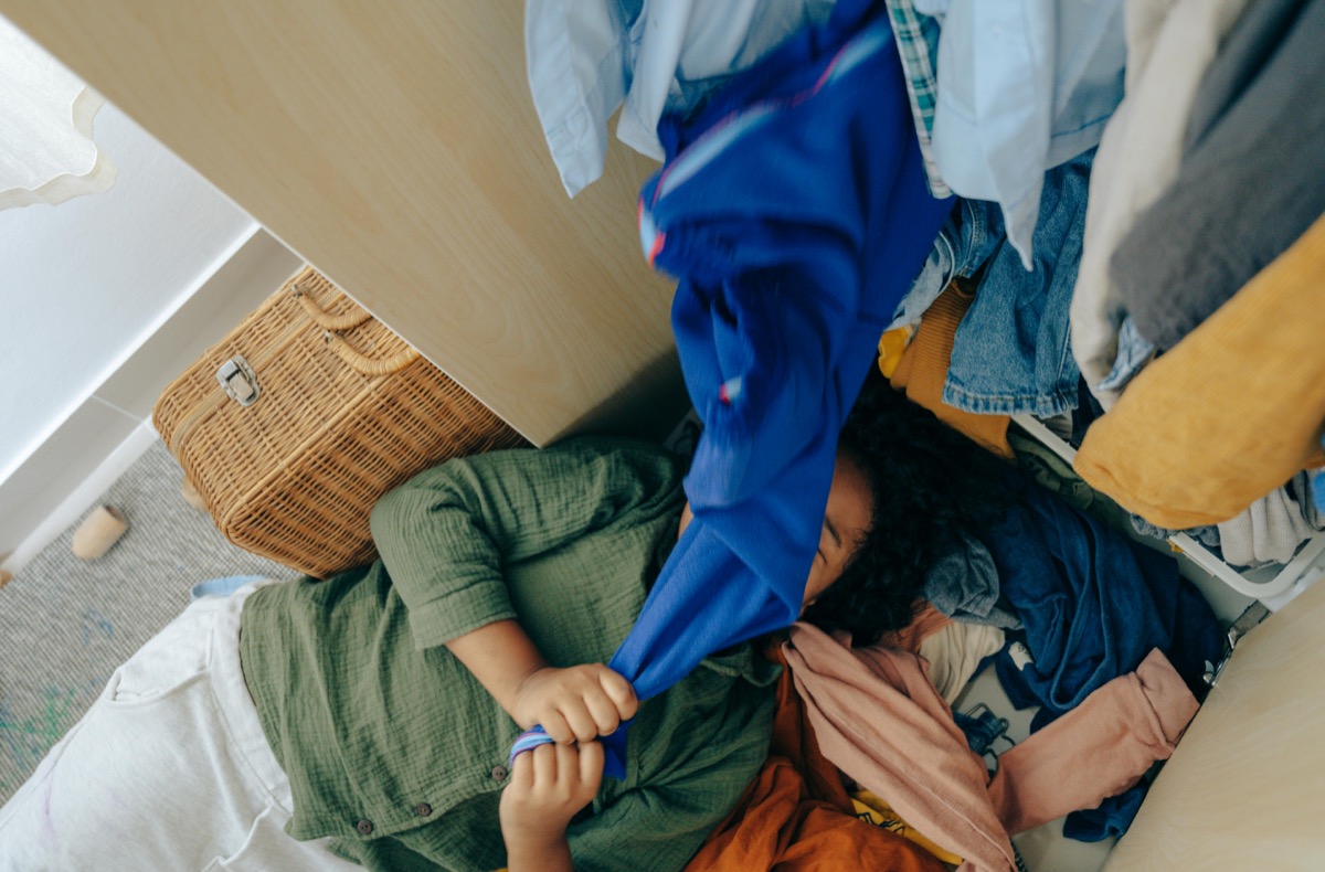 Decluttered clothes sorted into piles to sell