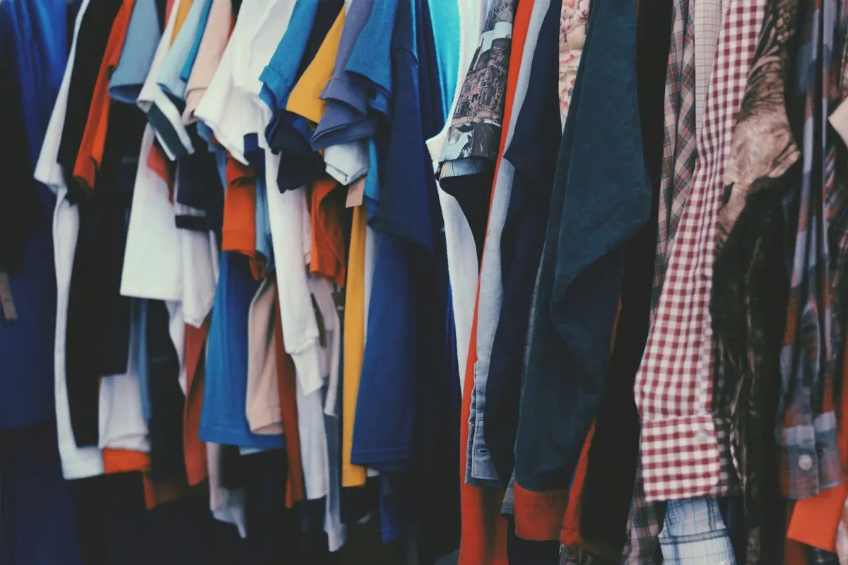 Folding clothes to photograph for a listing