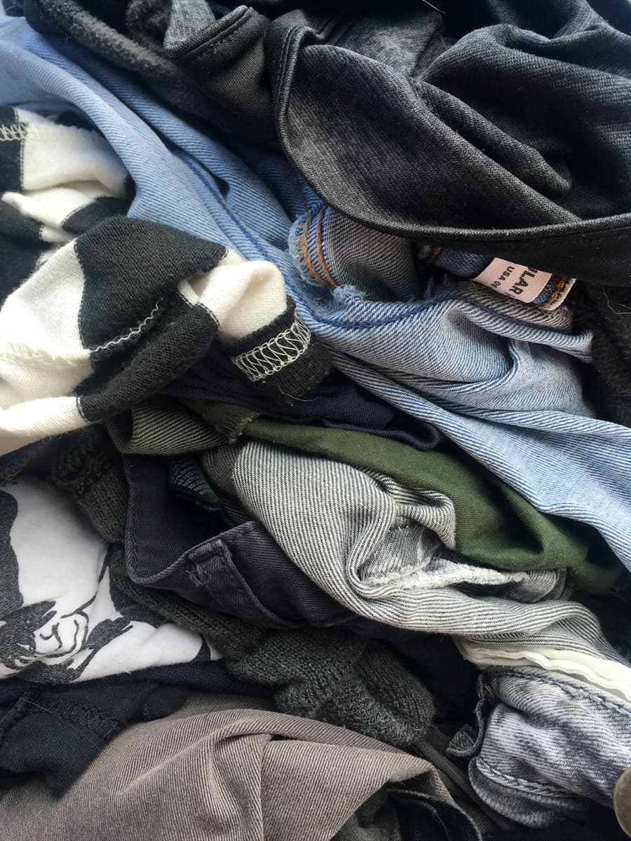 A clothing rail of second-hand items ready to resell
